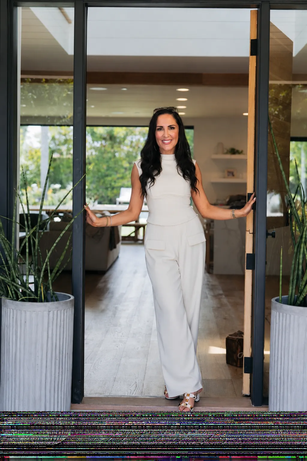 Valerie Sala at the front door of an Irvine home